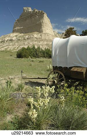 Stock Image -  Scotts Bluff National Monument, NE, Nebraska, covered wagons. Fotosearch
