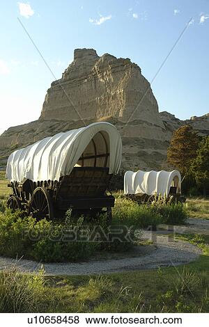 Stock Photo -  Scotts Bluff National Monument, NE, Nebraska, covered wagons. Fotosearch