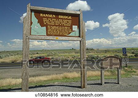 Stock Photograph -  Snake River Canyon, ID, Idaho, Hansen Bridge, wooden sign, historical marker. Fotosearch
