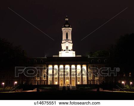 Stock Image -  State College, PA, Pennsylvania, Penn State University, Old Main, evening. Fotosearch