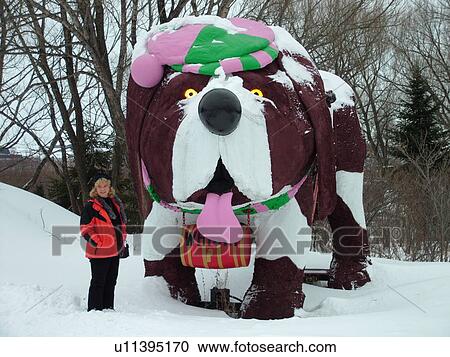 Ste-Anne-de-Beaupre, Quebec City, Quebec, Canada, Bee Museum, woman standing next to large Saint Bernard dog statue with whiskey barrel View Large Photo Image Stock Image - Ste-Anne-de-Beaupre, Quebec City, Quebec, Canada, Bee Museum, woman standing next to large Saint Bernard dog statue with whiskey barrel. Fotosearch
