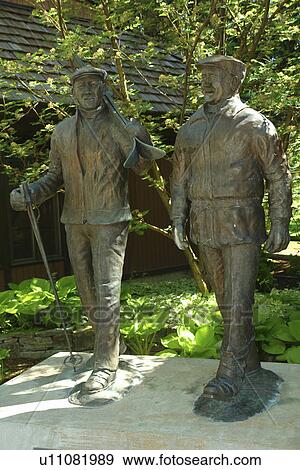Stock Photo -  Sun Valley, ID, Idaho, Sun Valley Lodge, statue of Sigi and Sepp. Fotosearch