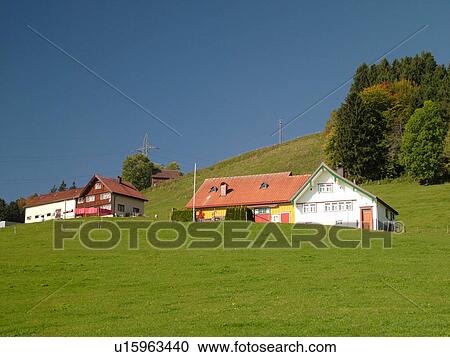 Stock Image -  Switzerland, Europe, Appenzell, typical Appenzell farmhouses and barns combined. Fotosearch
