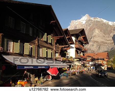 Stock Image -  Switzerland, Europe, Bern, Berne, Grindelwald, Bernese Alps, Berner Oberland, chalets, hotels, outdoor cafTs. Fotosearch