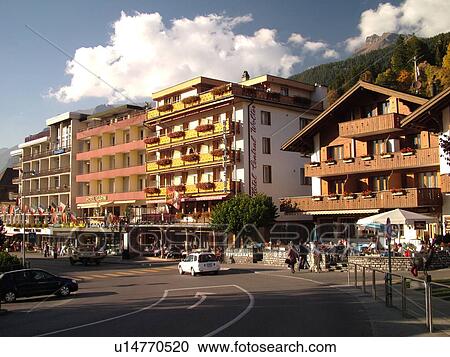 Stock Image -  Switzerland, Europe, Bern, Berne, Grindelwald, Bernese Alps, Berner Oberland, chalets, hotels, outdoor cafTs. Fotosearch