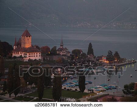Stock Image -  Switzerland, Europe, Bern, Berne, Spiez, Bernese Alps, Berner Oberland, Lake Thun, Thuner See, castle, evening. Fotosearch