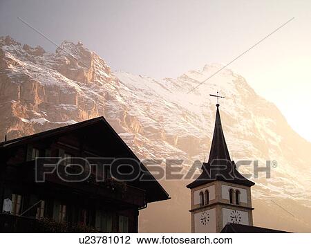 Stock Image -  Switzerland, Europe, Bern, Berne, Grindelwald, Bernese Alps, Berner Oberland, Eiger, church. Fotosearch