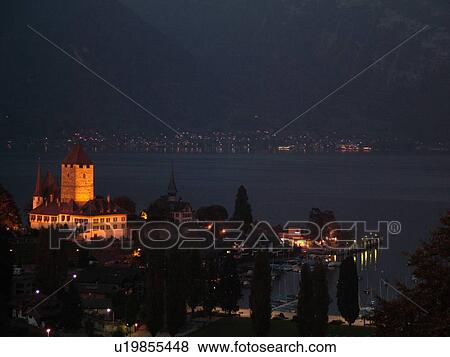 Stock Photo -  Switzerland, Europe, Bern, Berne, Spiez, Bernese Alps, Berner Oberland, Lake Thun, Thuner See, castle, evening. Fotosearch