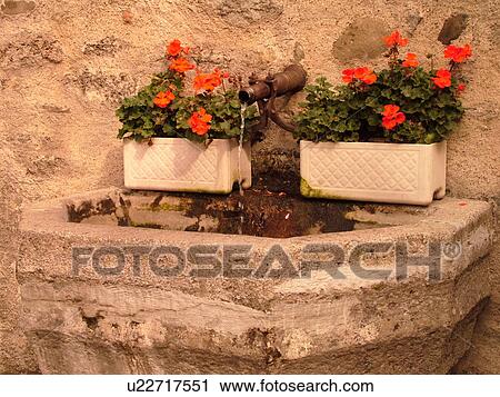 Stock Image -  Switzerland, Europe, Fribourg, Estavayer le Lac, village, water fountain. Fotosearch