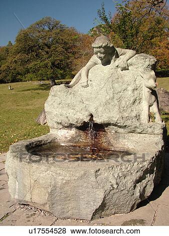 Stock Photo -  Switzerland, Europe, Maienfeld, Heidiland, Graubunden, Grisons, old stone fountain. Fotosearch