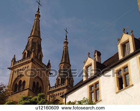 Stock Photo -  Switzerland, Europe, Neuchatel, La Collegiale, Romanesque-Gothic 12th century church, steeples. Fotosearch