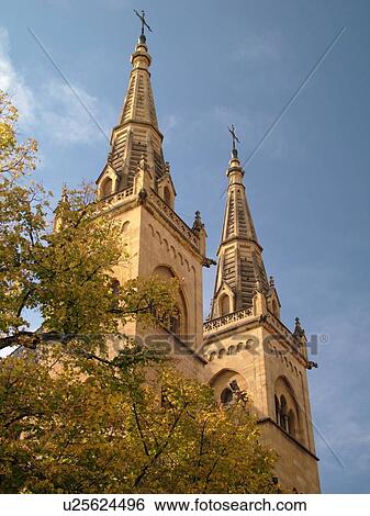 Stock Photograph -  Switzerland, Europe, Neuchatel, La Collegiale, Romanesque-Gothic 12th century church, steeples. Fotosearch