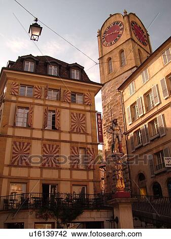 Stock Image -  Switzerland, Europe, Neuchatel, Fontaine du Banneret, Clock Tower. Fotosearch