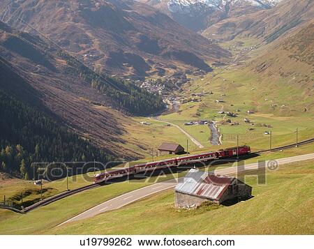 Stock Image -  Switzerland, Europe, Uri, Oberalp Pass, Oberalppass, Andermatt, Matterhorn-Gotthard-Bahn, The Glacier Express train. Fotosearch
