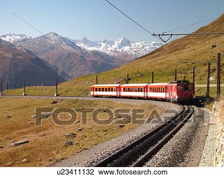 Stock Image -  Switzerland, Europe, Uri, Oberalp Pass, Oberalppass, Matterhorn-Gotthard-Bahn, The Glacier Express train. Fotosearch