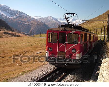 Stock Photo -  Switzerland, Europe, Uri, Oberalp Pass, Oberalppass, Matterhorn-Gotthard-Bahn, The Glacier Express train. Fotosearch