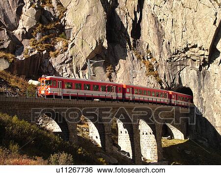 Stock Photograph -  Switzerland, Europe, Uri, Oberalp Pass, Oberalppass, Andermatt, Matterhorn-Gotthard-Bahn, The Glacier Express train, tunnel. Fotosearch