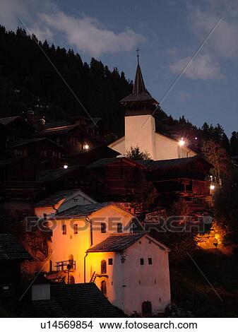 Switzerland, Europe, valais, wallis, Val d'Anniviers, Grimentz, alpine village, church, evening, illuminated View Large Photo Image Picture - Switzerland, Europe, valais, wallis, Val d'Anniviers, Grimentz, alpine village, church, evening, illuminated. Fotosearch
