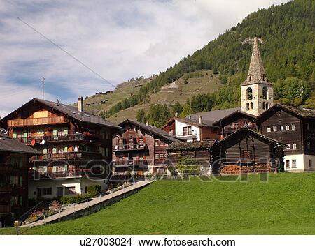 Picture -  Switzerland, Europe, valais, wallis, Val D'Herens, Evolene, village, chalets, church. Fotosearch