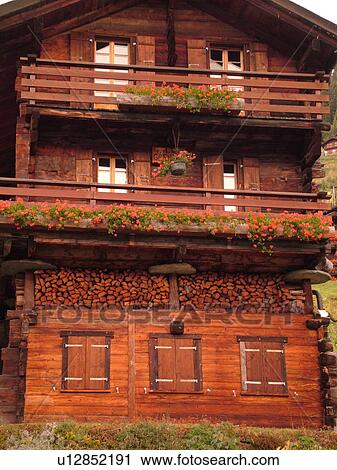 Switzerland, Europe, valais, wallis, Val d'Anniviers, Grimentz, old wooden chalet, flowers, window boxes, wooden shutters, balconies, woodpile View Large Photo Image Stock Image - Switzerland, Europe, valais, wallis, Val d'Anniviers, Grimentz, old wooden chalet, flowers, window boxes, wooden shutters, balconies, woodpile . Fotosearch