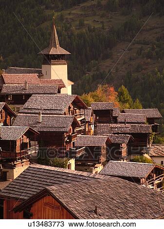 Switzerland, Europe, valais, wallis, Val d'Anniviers, Grimentz, alpine village, church, rooftops View Large Photo Image Stock Image - Switzerland, Europe, valais, wallis, Val d'Anniviers, Grimentz, alpine village, church, rooftops. Fotosearch
