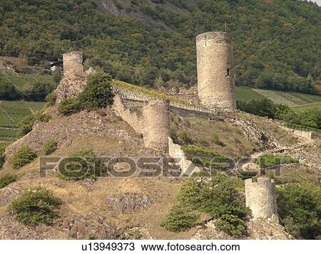 Stock Image -  Switzerland, Europe, valais, wallis, Saillon, Rhone Valley, Fendant Wine Region, castle, ruins. Fotosearch