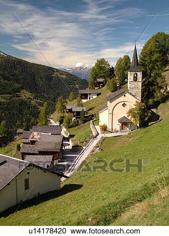 Stock Image -  Switzerland, Europe, valais, wallis, Val d'Anniviers, Chandolin, church, alpine village, snow-capped mountain peaks. Fotosearch
