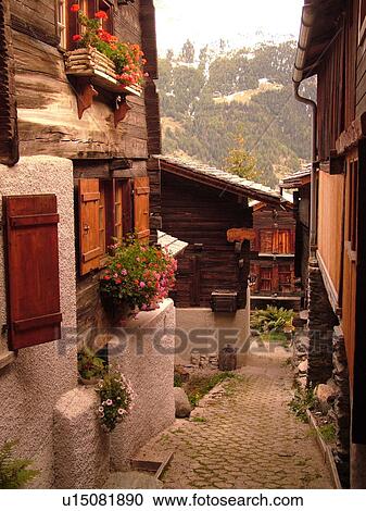 Stock Image -  Switzerland, Europe, valais, wallis, Val d'Anniviers, Grimentz, alpine village, old chalets. Fotosearch