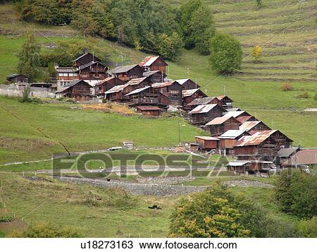 Stock Image -  Switzerland, Europe, valais, wallis, Val D'Heremence, Mache, chalets, alpine village. Fotosearch