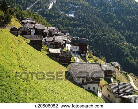 Stock Image -  Switzerland, Europe, valais, wallis, Val d'Anniviers, Chandolin, alpine village, chalets, mountainside. Fotosearch