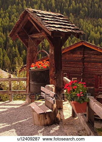 Switzerland, Europe, valais, wallis, Val d'Anniviers, Grimentz, flowers decorate a large iron kettle, wishing well View Large Photo Image Stock Photo - Switzerland, Europe, valais, wallis, Val d'Anniviers, Grimentz, flowers decorate a large iron kettle, wishing well. Fotosearch