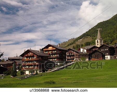 Stock Photo -  Switzerland, Europe, valais, wallis, Val D'Herens, Evolene, village, chalets, church. Fotosearch