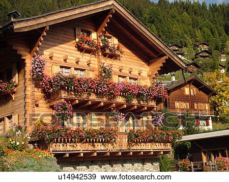 Stock Photo -  Switzerland, Europe, valais, wallis, Val d'Anniviers, Grimentz, alpine village, mountain chalets decorated with flowers. Fotosearch