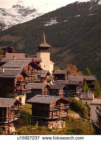 Stock Photo -  Switzerland, Europe, valais, wallis, Val d'Anniviers, Grimentz, alpine village, church, rooftops. Fotosearch