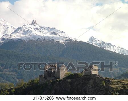 Stock Photograph -  Switzerland, Europe, valais, wallis, Sion, Rhone Valley, Fendant Wine Region, ChGteau de Tourbillon, alps, snow-capped mountains. Fotosearch