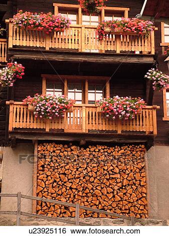 Switzerland, Europe, valais, wallis, Val d'Anniviers, Grimentz, alpine village, chalet, woodpile, balconies, window boxes, flowers, fatade View Large Photo Image Stock Photograph - Switzerland, Europe, valais, wallis, Val d'Anniviers, Grimentz, alpine village, chalet, woodpile, balconies, window boxes, flowers, fatade. Fotosearch