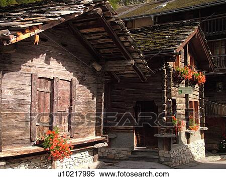 Switzerland, Europe, valais, wallis, Val D'Herens, Evolene, old chalets decorated with flowers View Large Photo Image Stock Photography - Switzerland, Europe, valais, wallis, Val D'Herens, Evolene, old chalets decorated with flowers. Fotosearch