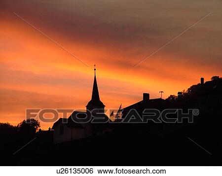 Stock Photograph -  Switzerland, Europe, Vaud, Fechy, La Cote, sunset, village, silhouette. Fotosearch
