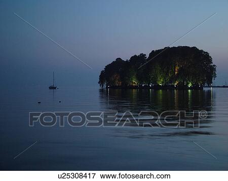 Stock Photo -  Switzerland, Europe, Vaud, La Cote, Rolle, Lake Geneva, Lac Leman, evening, Isle Jean Jacques Rousseau. Fotosearch