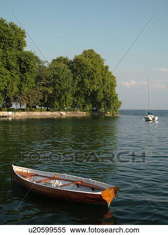 Stock Photography -  Switzerland, Europe, Vaud, La Cote, Rolle, Lake Geneva, wooden rowboat. Fotosearch