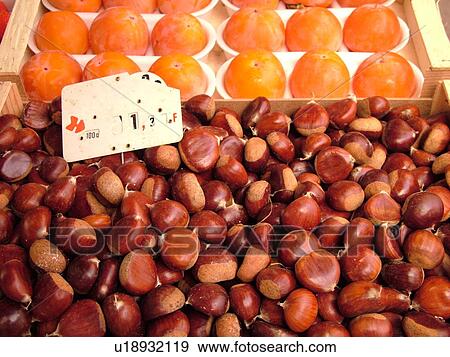 Stock Photo -  Switzerland, Europe, Vaud, Morges, La Cote, downtown, City Market, chestnuts, oranges, close-up. Fotosearch