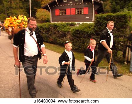 Picture -  Switzerland, Europe, Vaud, St. Cergues, La Desalpe, festival, cows with floral headdresses, farmers. Fotosearch