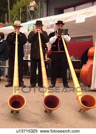 Switzerland, Europe, Vaud, St. Cergues, La Desalpe, festival, men playing alphorns View Large Photo Image Stock Photography - Switzerland, Europe, Vaud, St. Cergues, La Desalpe, festival, men playing alphorns. Fotosearch