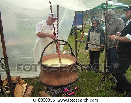 Stock Photography -  Switzerland, Europe, Vaud, St. Cergues, Desalpe, festival, cheese making demonstration, fondue, large kettle . Fotosearch
