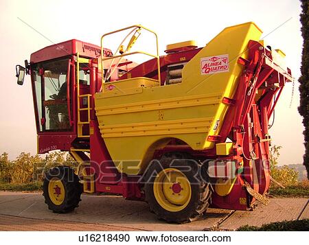 Stock Image -  Switzerland, Europe, Vaud, Mont-Sur-Rolle, La Cote, wine harvest, vineyards, grape collection machine. Fotosearch