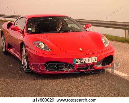 Switzerland, Europe, Vaud, Mont-Sur-Rolle, La Cote, Red Ferrari, sports car, road View Large Photo Image Stock Photo - Switzerland, Europe, Vaud, Mont-Sur-Rolle, La Cote, Red Ferrari, sports car, road. Fotosearch