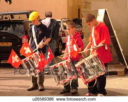 Stock Photograph -  Switzerland, Europe, Vaud, Tartegnin, La Cote, wine festival, drummers, playing drums, village. Fotosearch