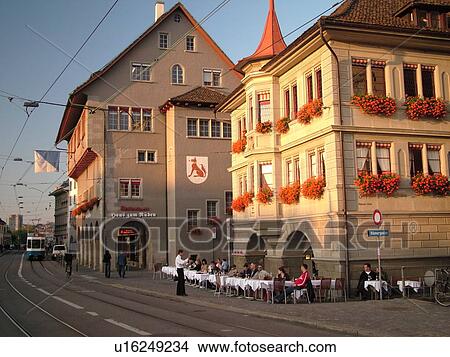 Picture -  Switzerland, Europe, Zurich, Zuerich, Limmatquai, outdoor cafT, trolley, tram. Fotosearch