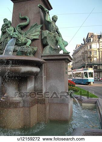Switzerland, Europe, Zurich, Zuerich, downtown, Bahnhofstrasse, trolley, tram, fountain, commuters View Large Photo Image Stock Image - Switzerland, Europe, Zurich, Zuerich, downtown, Bahnhofstrasse, trolley, tram, fountain, commuters. Fotosearch