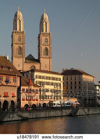 Stock Image -  Switzerland, Europe, Zurich, Zuerich, Limmat River, Grossmunster Cathedral, Limmatquai. Fotosearch